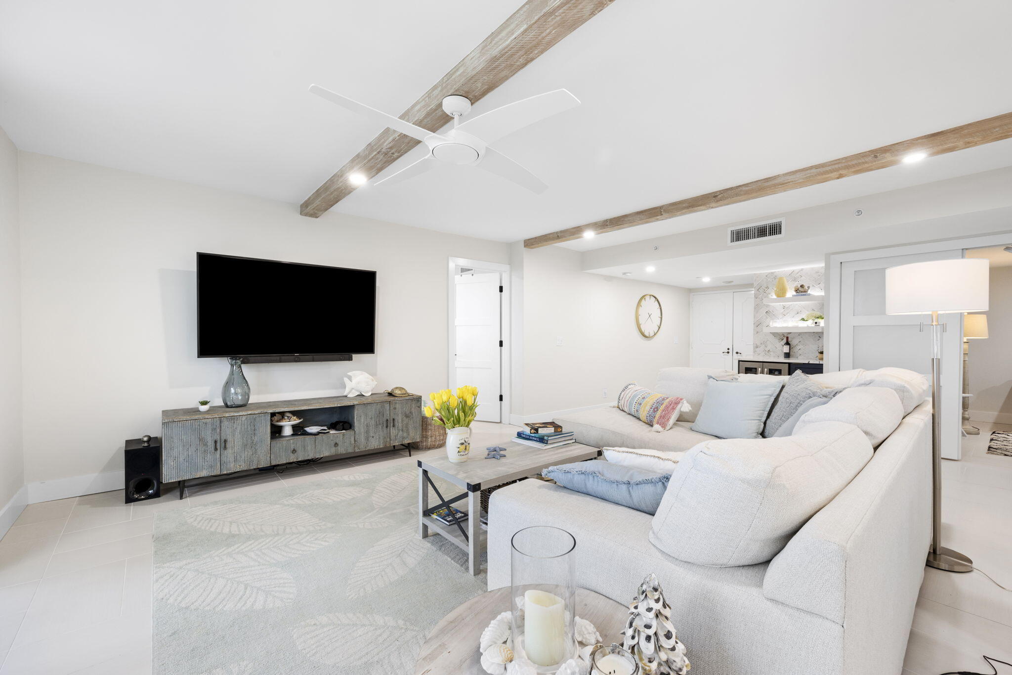 500 Ocean Drive, Unit E3A Juno Beach, FL 33408 - Photo 6 of 28 a living room with furniture and a flat screen tv