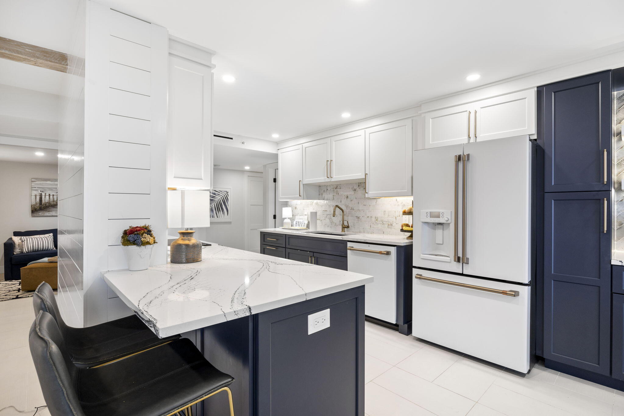 500 Ocean Drive, Unit E3A Juno Beach, FL 33408 - Photo 9 of 28 a kitchen with a refrigerator a stove a sink and chairs
