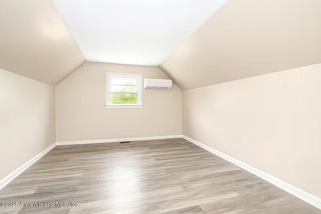 a bathroom with a toilet a sink and a mirror