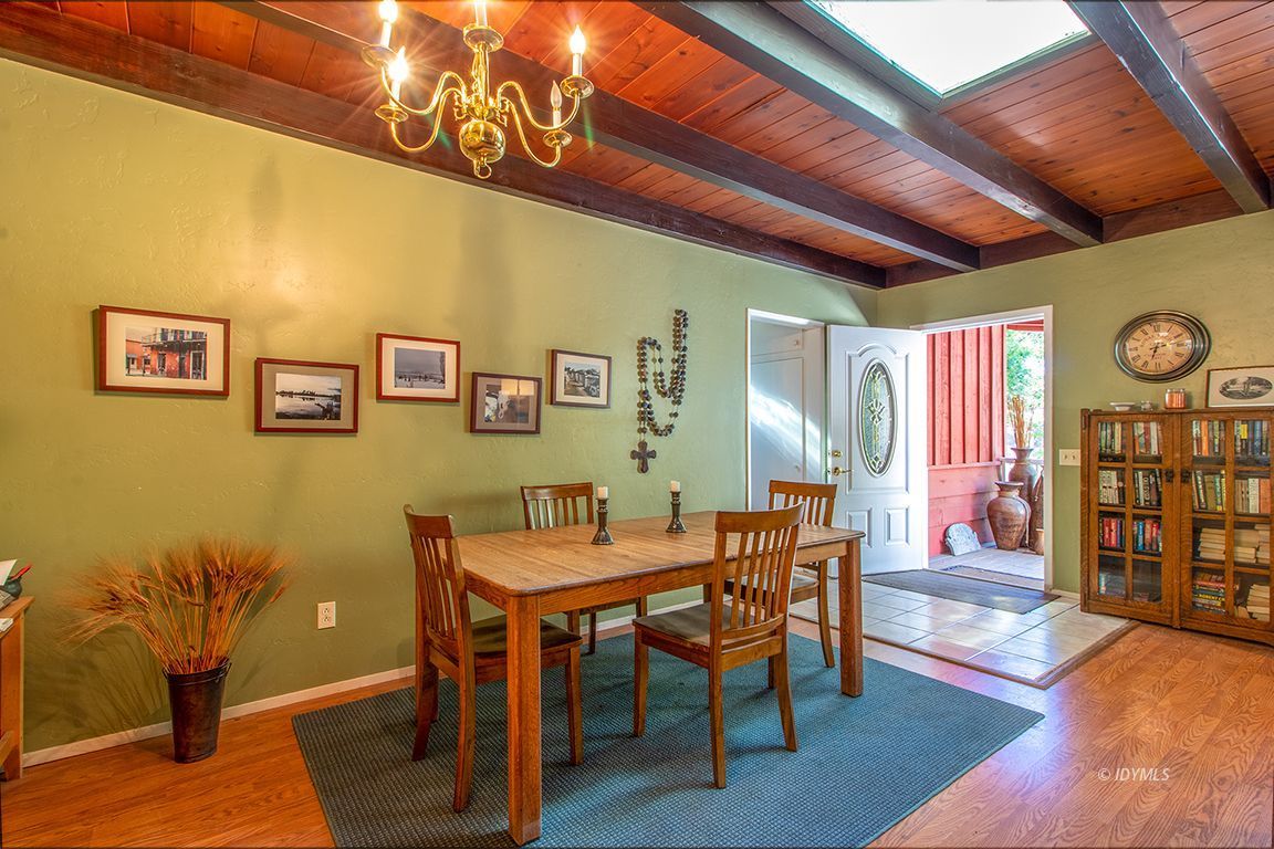 54789 Daryll Road Idyllwild, CA 92549 - Photo 12 of 44 a dining room with furniture and wooden floor