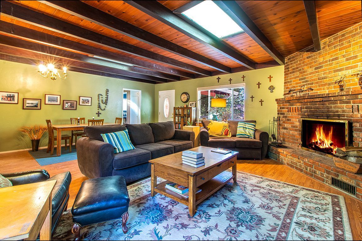 54789 Daryll Road Idyllwild, CA 92549 - Photo 15 of 44 a living room with furniture and a fireplace