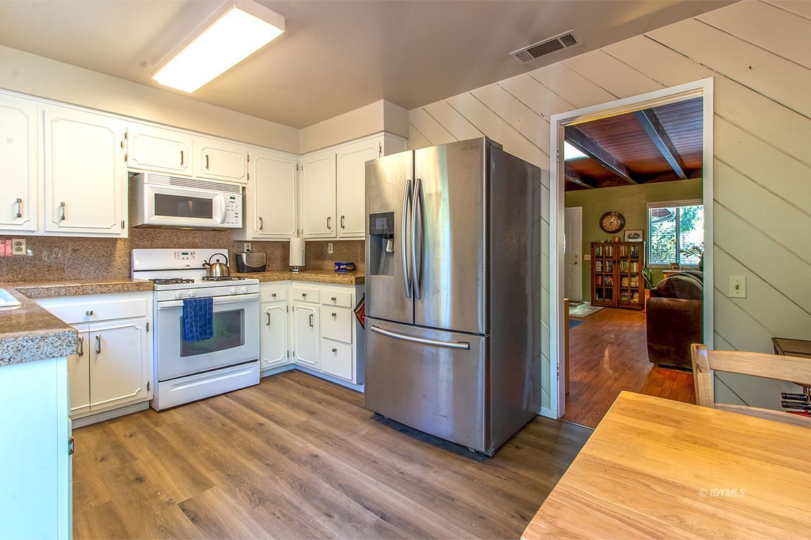 54789 Daryll Road Idyllwild, CA 92549 - Photo 19 of 44 a kitchen with stainless steel appliances a refrigerator sink and microwave