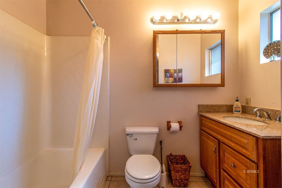54789 Daryll Road Idyllwild, CA 92549 - Photo 24 of 44 a bathroom with a toilet sink and mirror