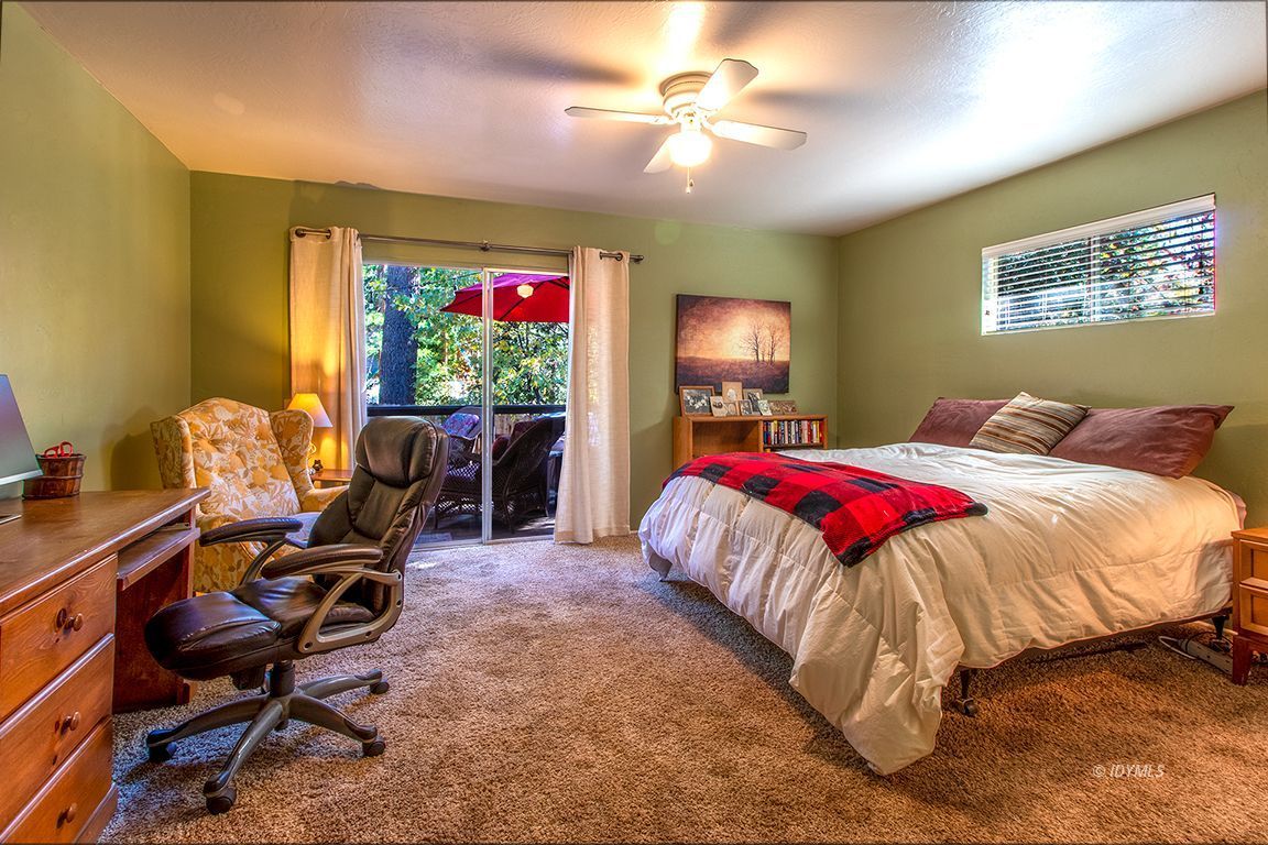 54789 Daryll Road Idyllwild, CA 92549 - Photo 27 of 44 a bed room with a bed window and a chair