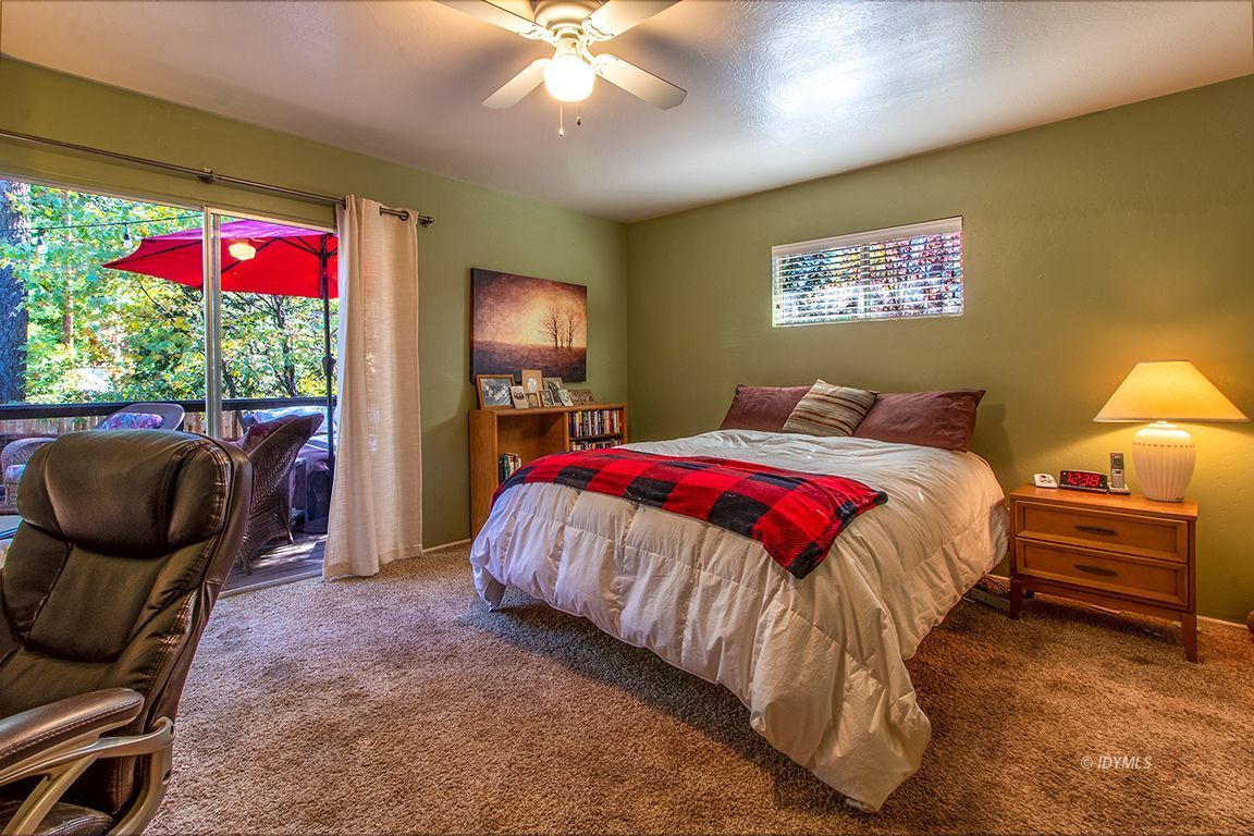 54789 Daryll Road Idyllwild, CA 92549 - Photo 28 of 44 a bedroom with a bed and a chandelier