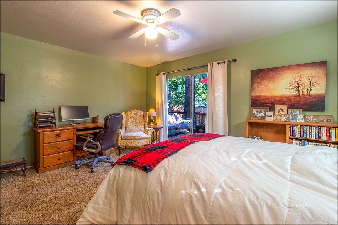 54789 Daryll Road Idyllwild, CA 92549 - Photo 29 of 44 a bedroom with a bed and a flat screen tv
