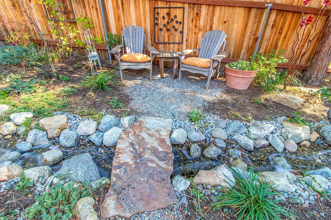 54789 Daryll Road Idyllwild, CA 92549 - Photo 31 of 44 a chair and table sitting in backyard with plants