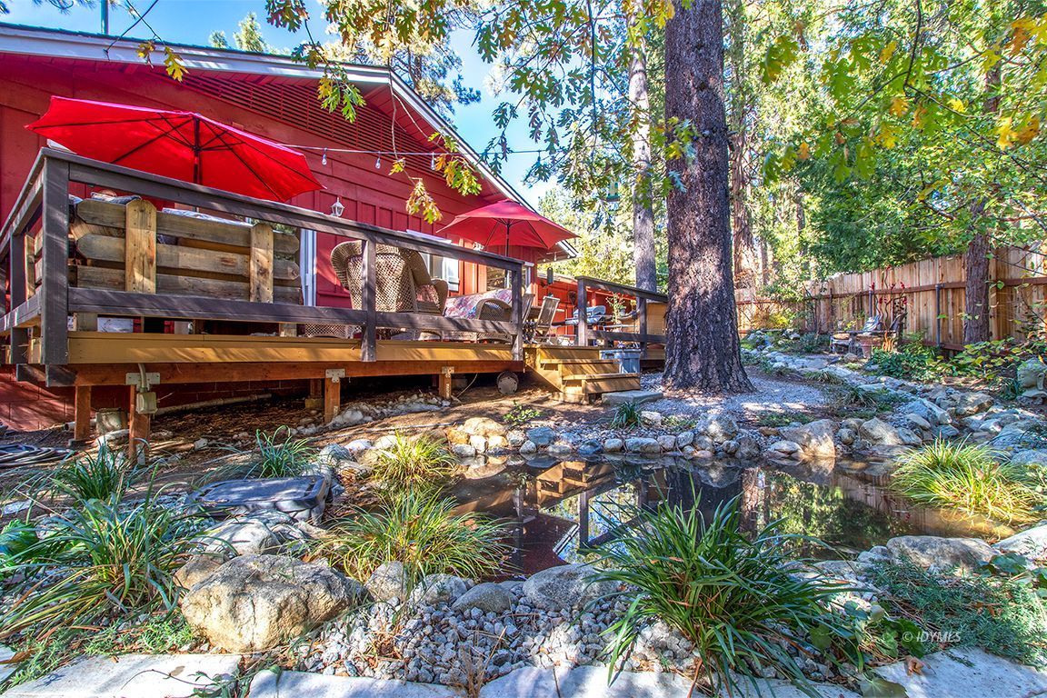 54789 Daryll Road Idyllwild, CA 92549 - Photo 32 of 44 a view of a house with a yard and sitting area