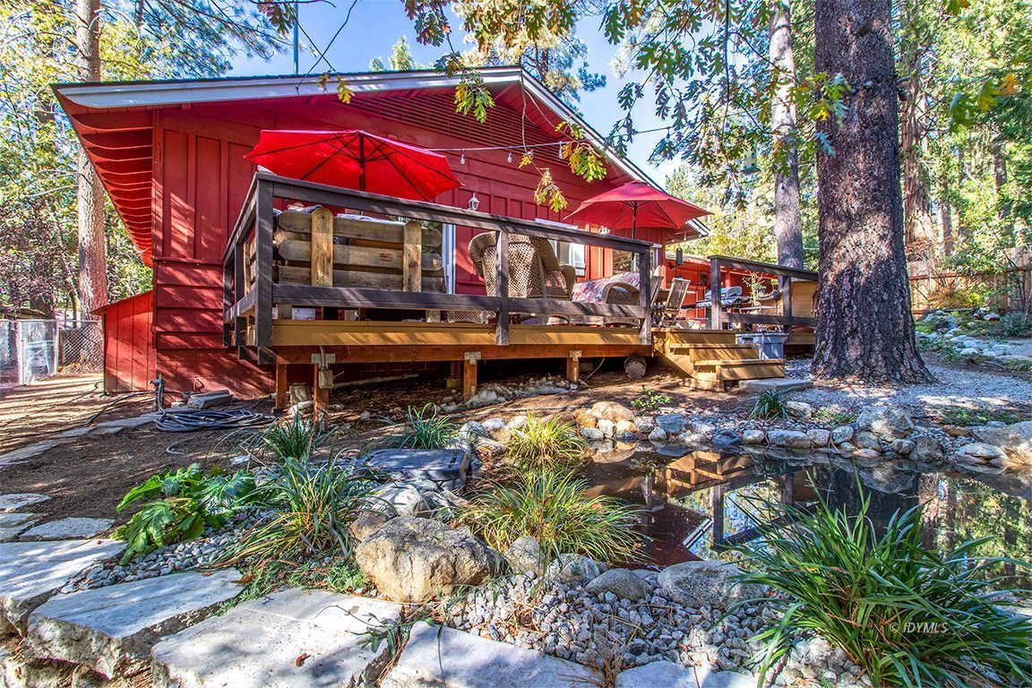 54789 Daryll Road Idyllwild, CA 92549 - Photo 33 of 44 a view of swimming pool with a table and chairs under an umbrella