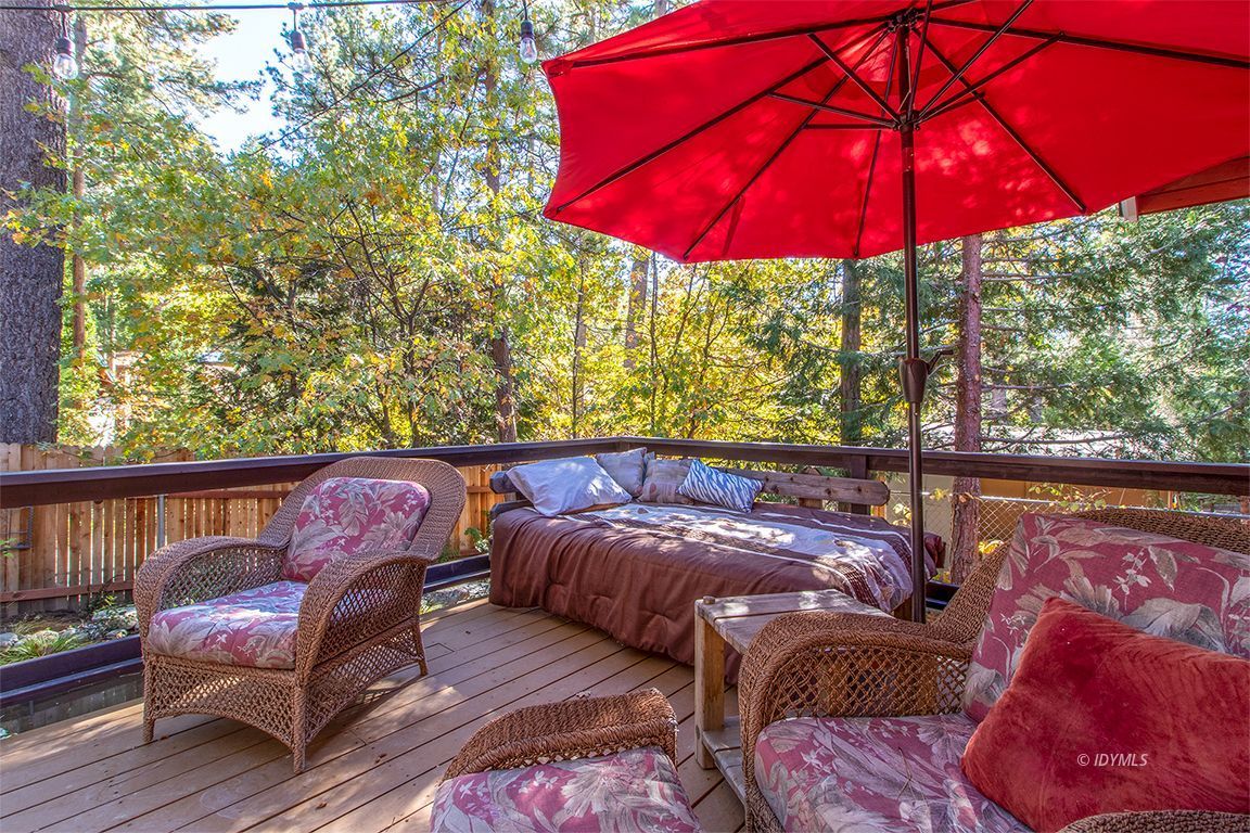 54789 Daryll Road Idyllwild, CA 92549 - Photo 41 of 44 a view of balcony with furniture and umbrella