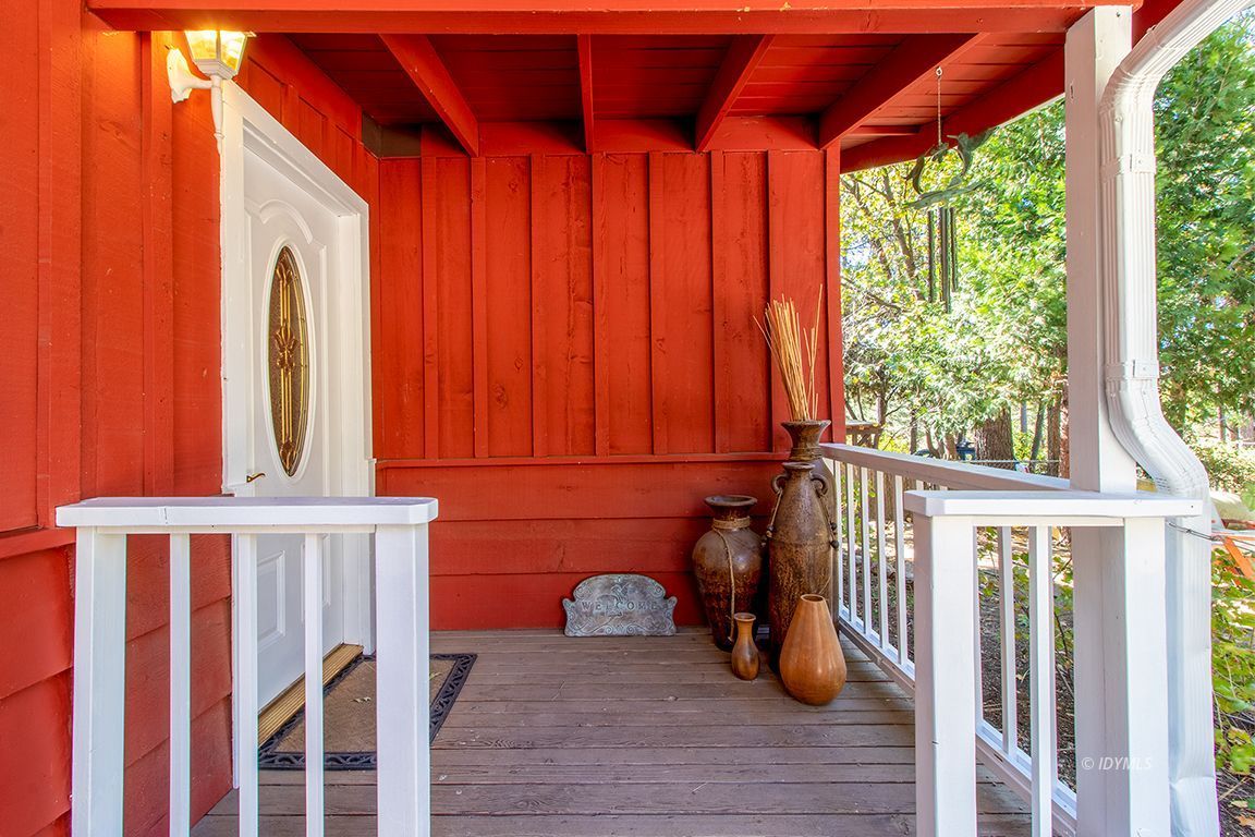 54789 Daryll Road Idyllwild, CA 92549 - Photo 5 of 44 a view of a porch with wooden floor and outdoor space