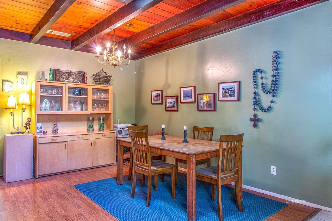 54789 Daryll Road Idyllwild, CA 92549 - Photo 10 of 44 a view of a dining room with furniture and wooden floor