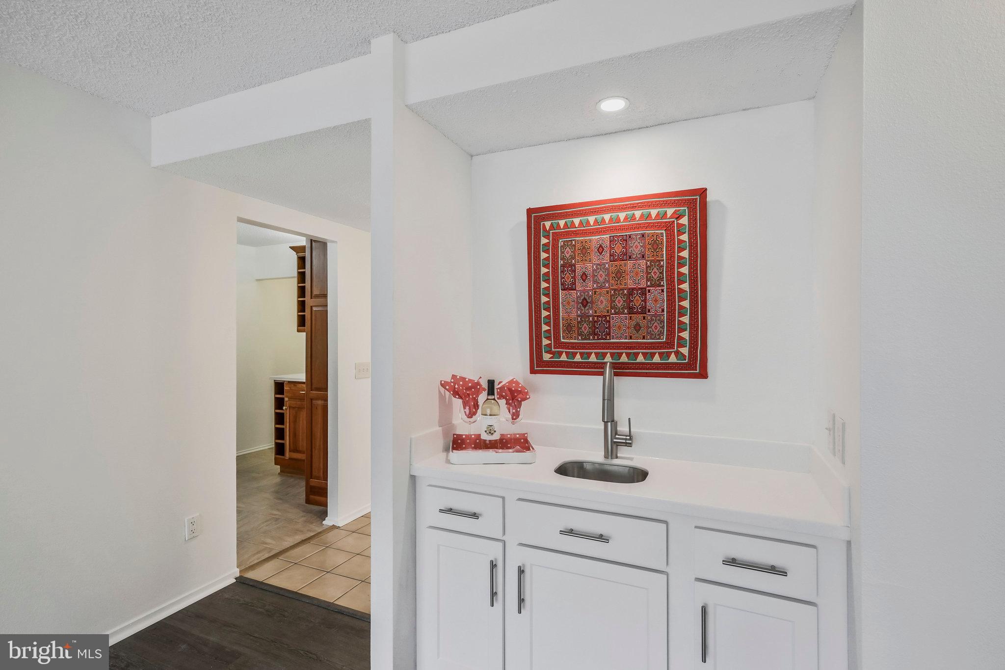 6101 Edsall Road, Unit 712 Alexandria, VA 22304 - Photo 9 of 53 a view of a hallway with cabinet and cabinet