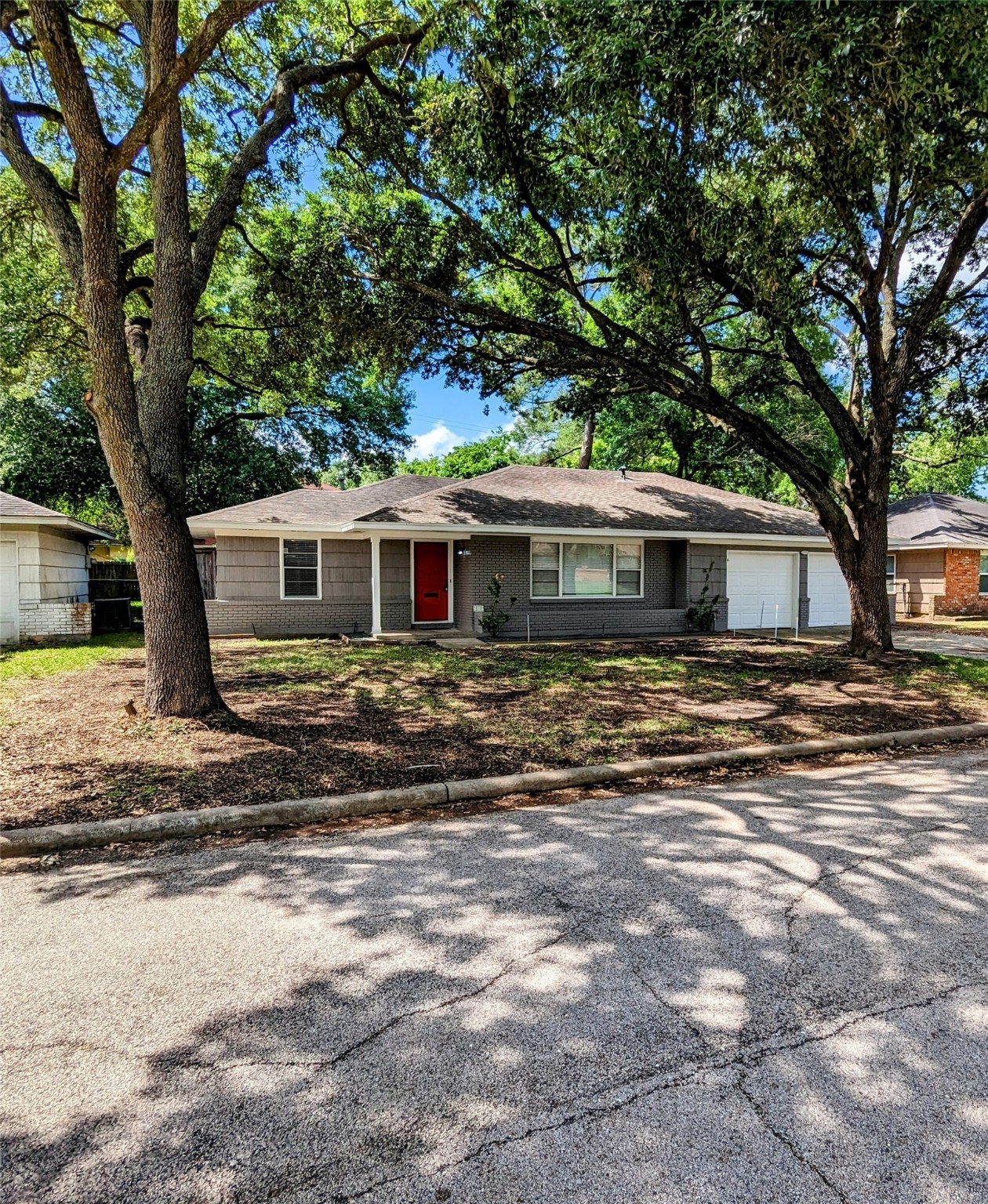 3111 Deal Street Houston, TX 77025 - Photo 2 of 39 a front view of a house with a garden