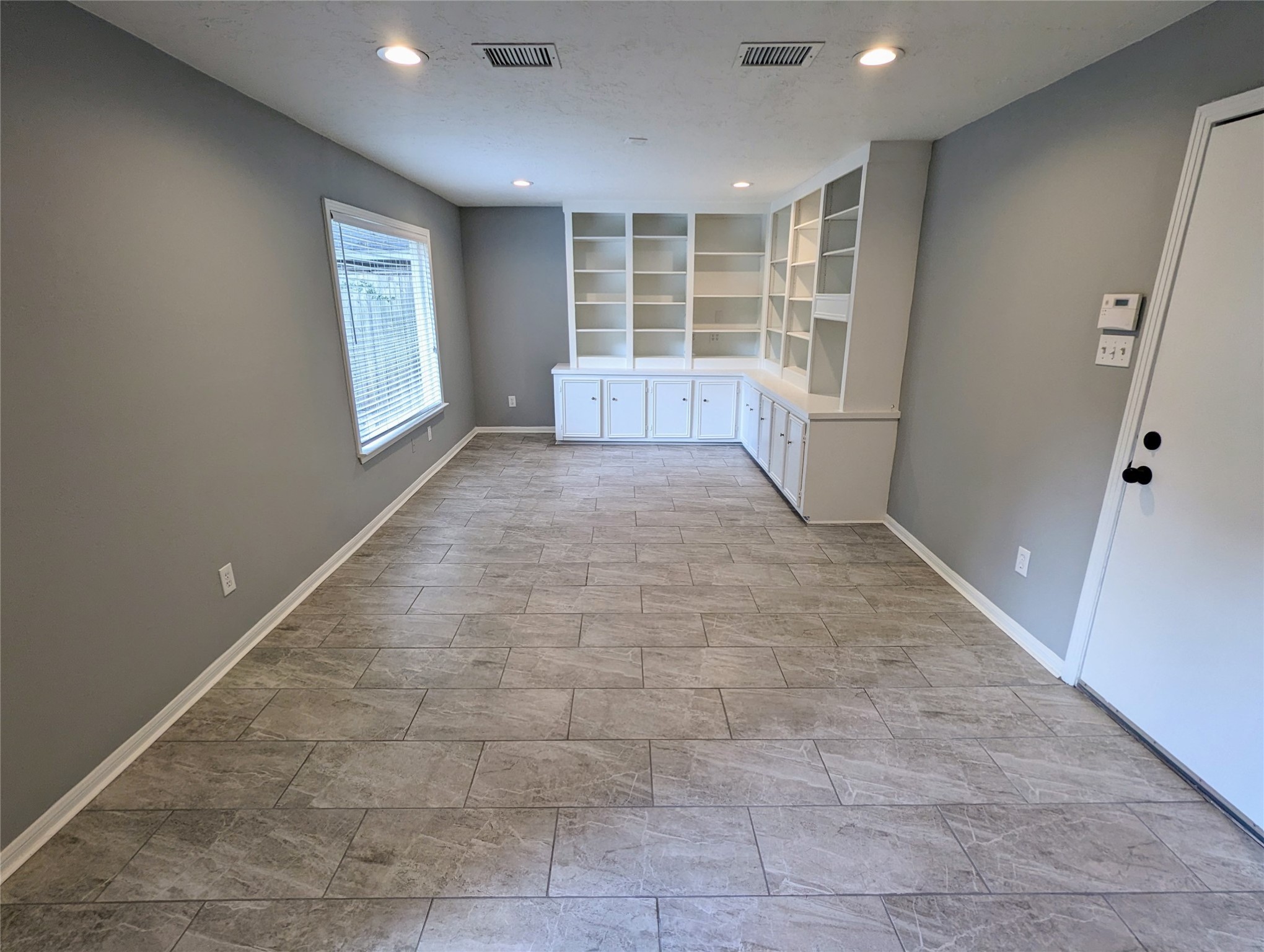 3111 Deal Street Houston, TX 77025 - Photo 21 of 39 a view of an empty room with a window