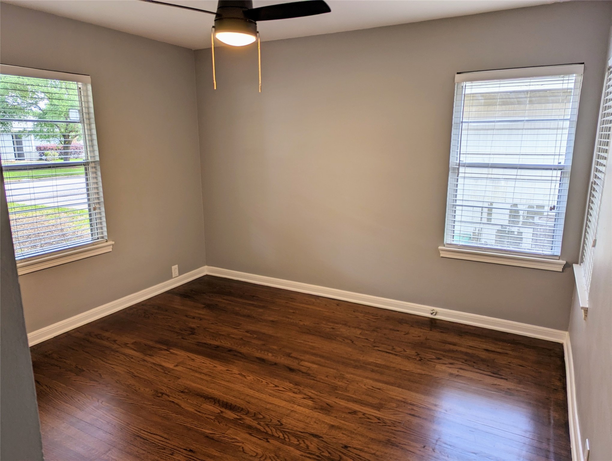 3111 Deal Street Houston, TX 77025 - Photo 23 of 39 a view of an empty room with wooden floor and a window