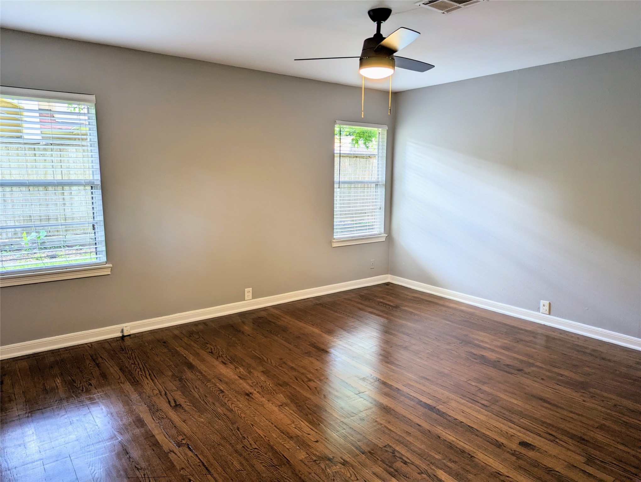 3111 Deal Street Houston, TX 77025 - Photo 31 of 39 wooden floor in an empty room with a window