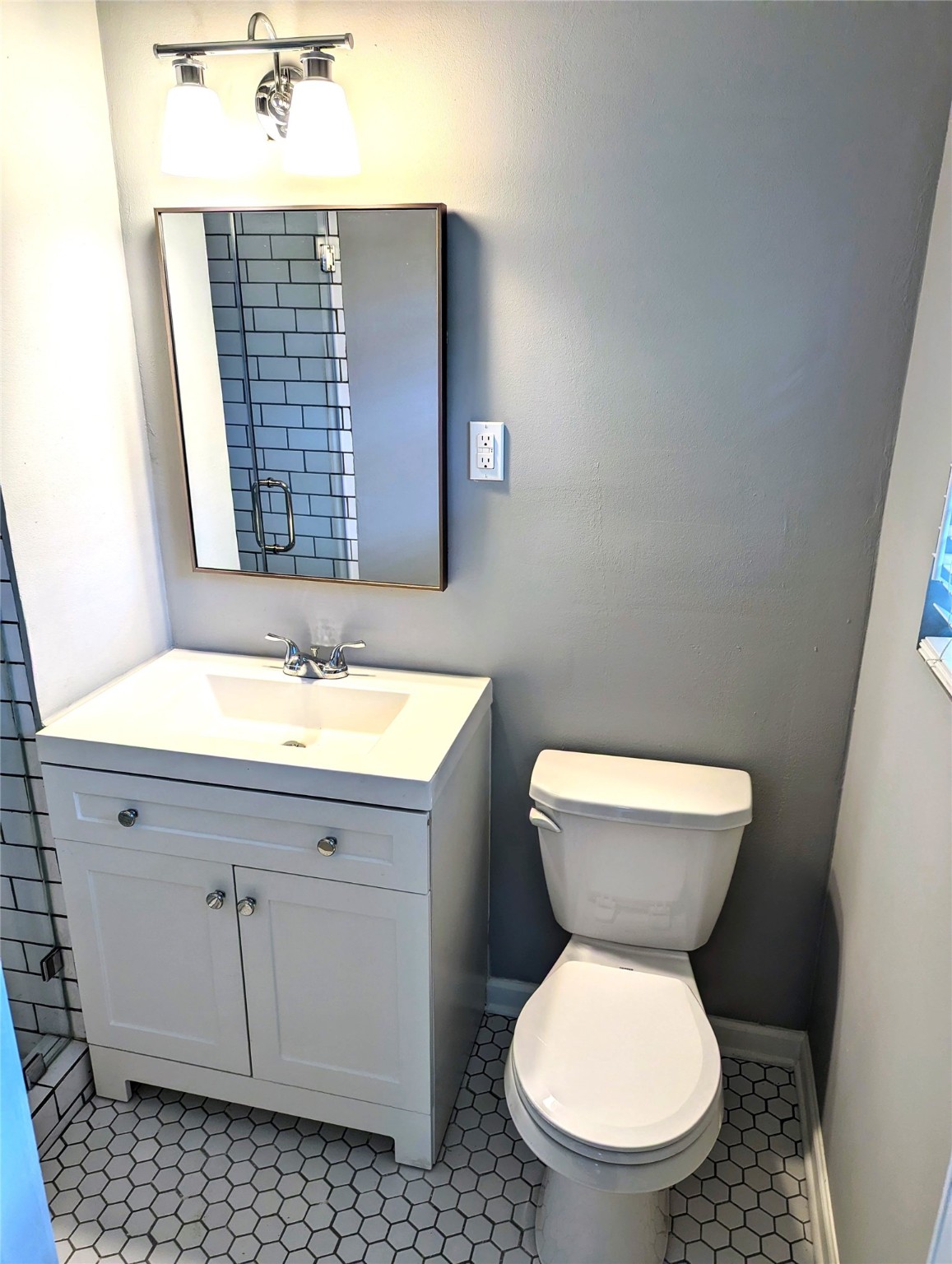 3111 Deal Street Houston, TX 77025 - Photo 34 of 39 a bathroom with a toilet sink and mirror