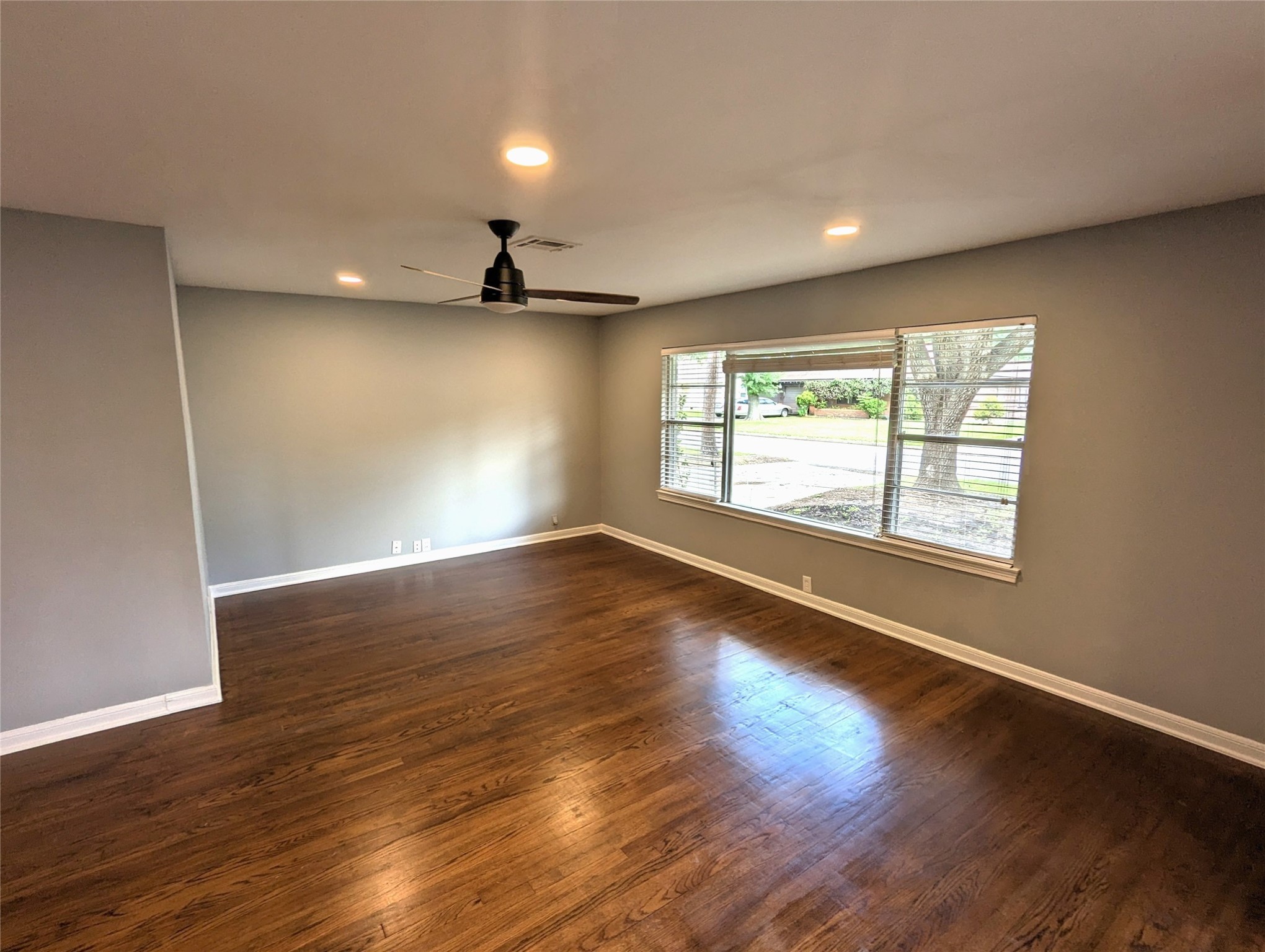 3111 Deal Street Houston, TX 77025 - Photo 6 of 39 a view of empty room with wooden floor and fan