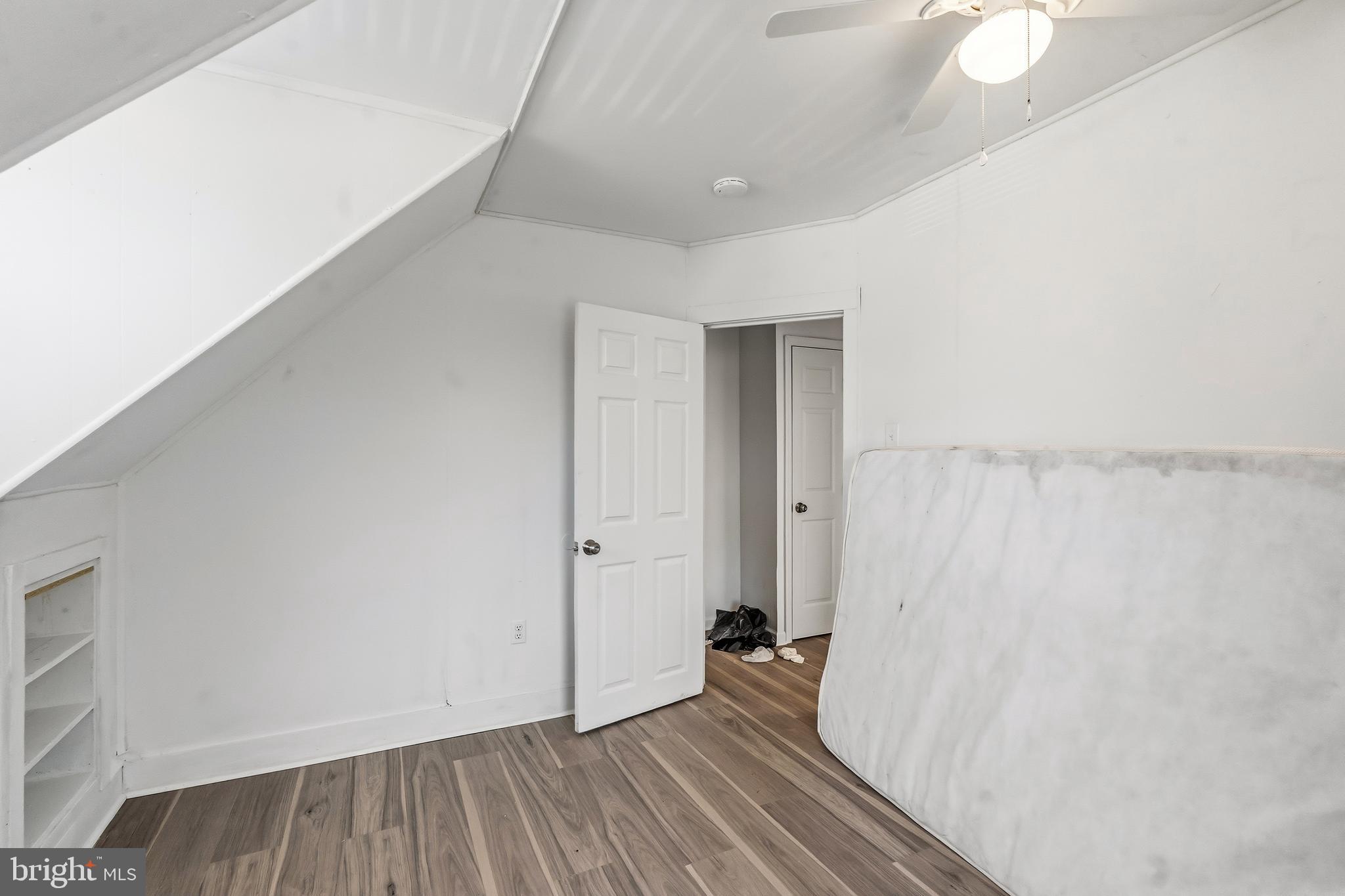 21-23 Harding Avenue Pennsville, NJ 08070 - Photo 16 of 35 a view of a room with wooden floor and a window