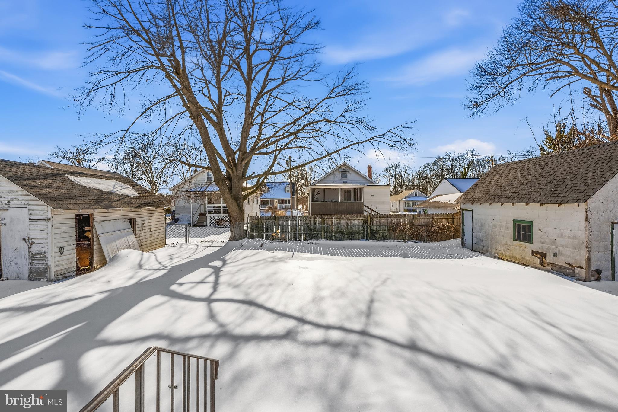 21-23 Harding Avenue Pennsville, NJ 08070 - Photo 31 of 35 a view of a house with snow on the road