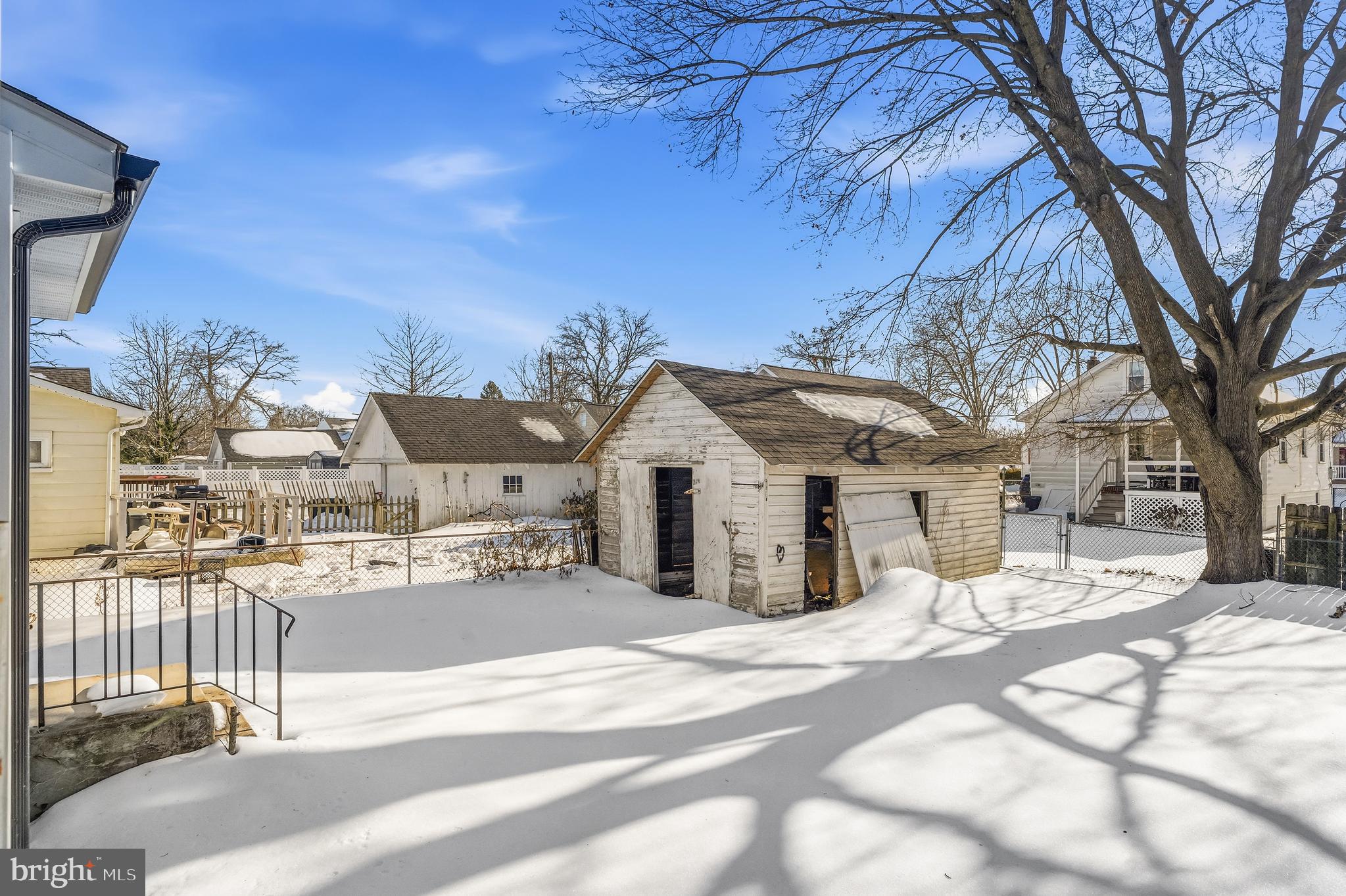 21-23 Harding Avenue Pennsville, NJ 08070 - Photo 32 of 35 a view of a house with a snow in the yard