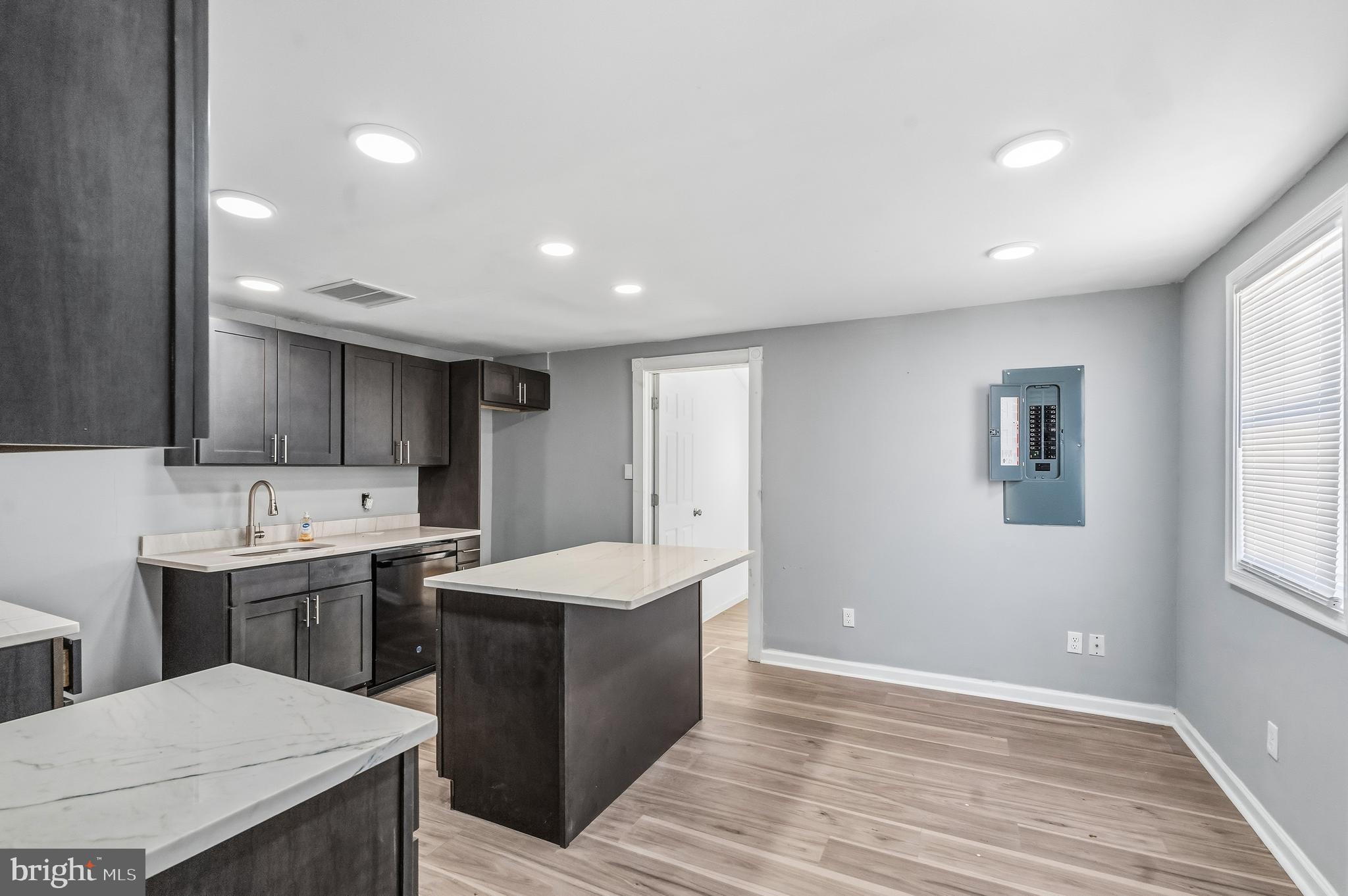 21-23 Harding Avenue Pennsville, NJ 08070 - Photo 5 of 35 a kitchen with a sink a window and cabinets