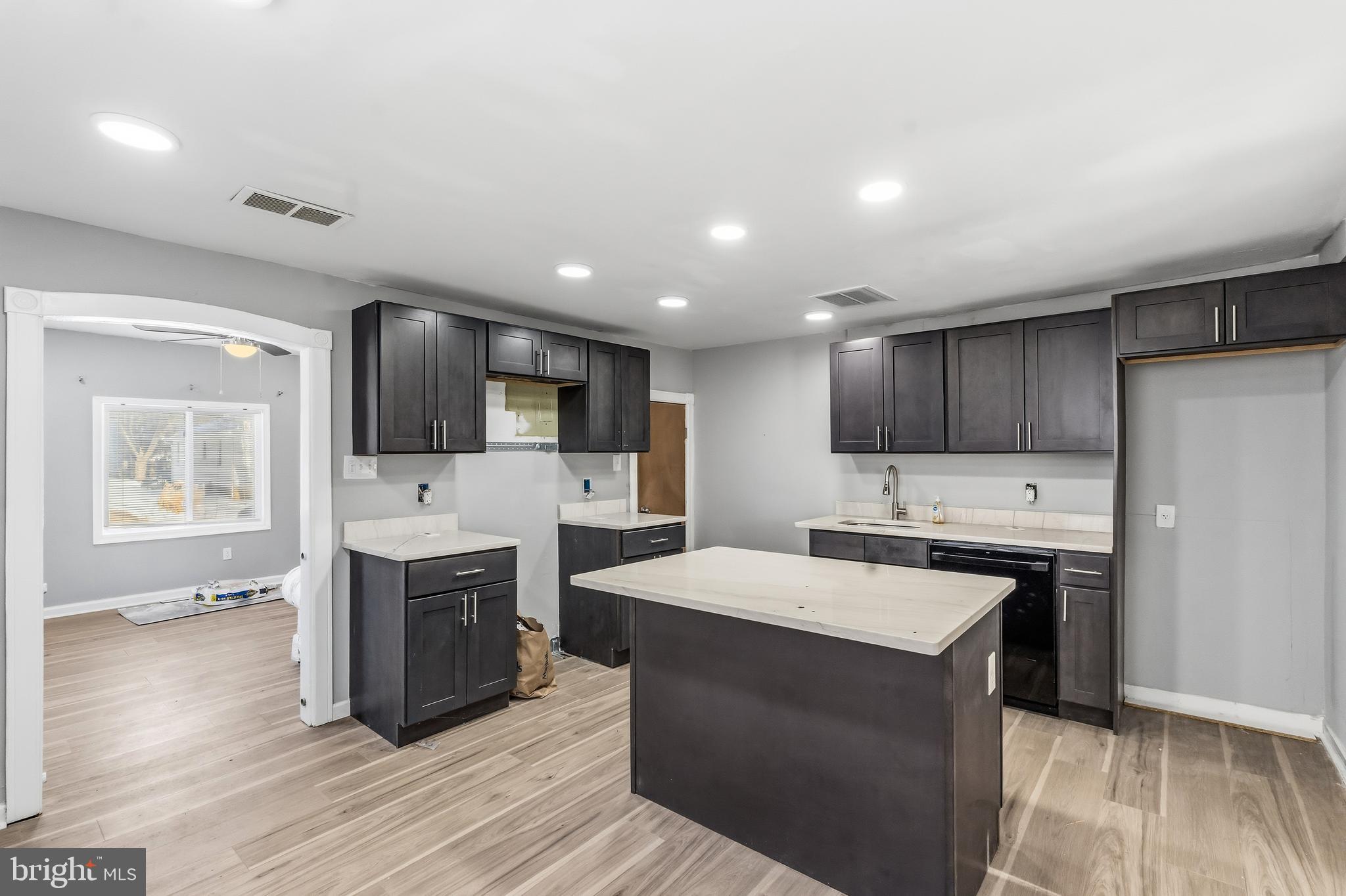 21-23 Harding Avenue Pennsville, NJ 08070 - Photo 7 of 35 a large kitchen with stainless steel appliances kitchen island granite countertop a stove and a sink