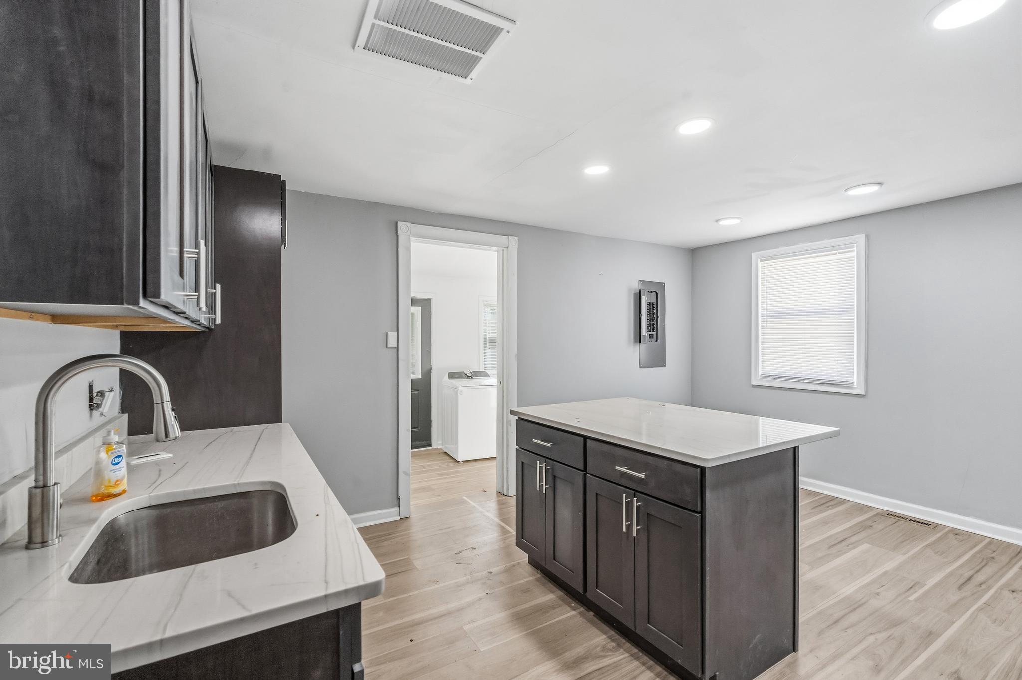 21-23 Harding Avenue Pennsville, NJ 08070 - Photo 9 of 35 a kitchen with a sink stove and cabinets