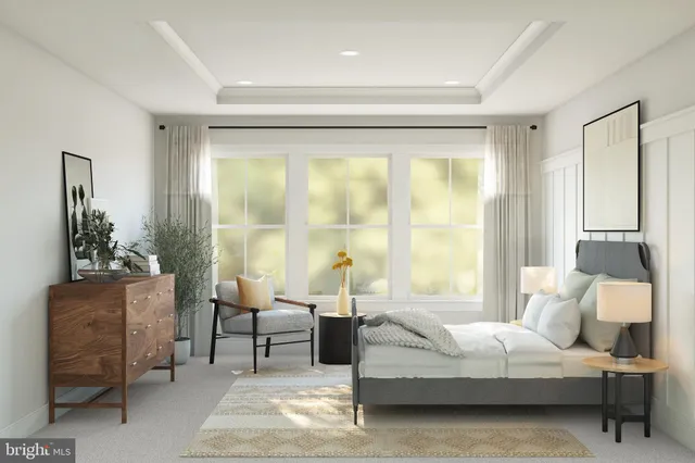 a bedroom with a bed and large window