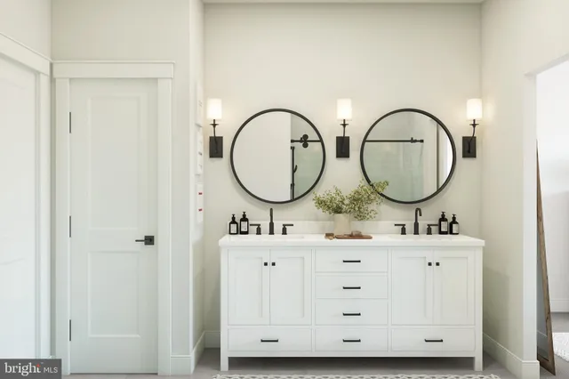 a bathroom with 2 sink and a mirror