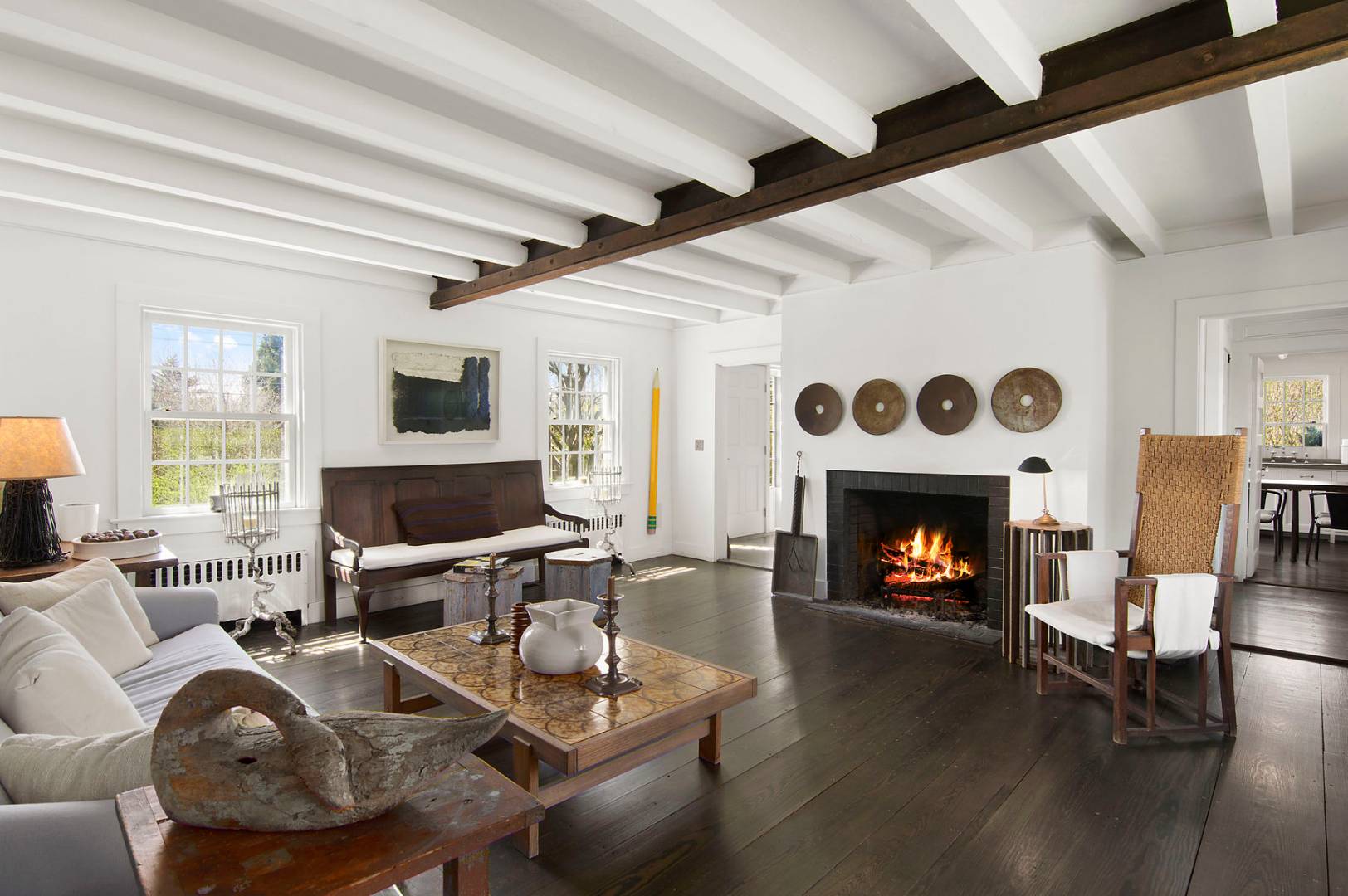 56 Sagaponack Road Bridgehampton, NY 11932 - Photo 2 of 15 a living room with furniture and a fireplace