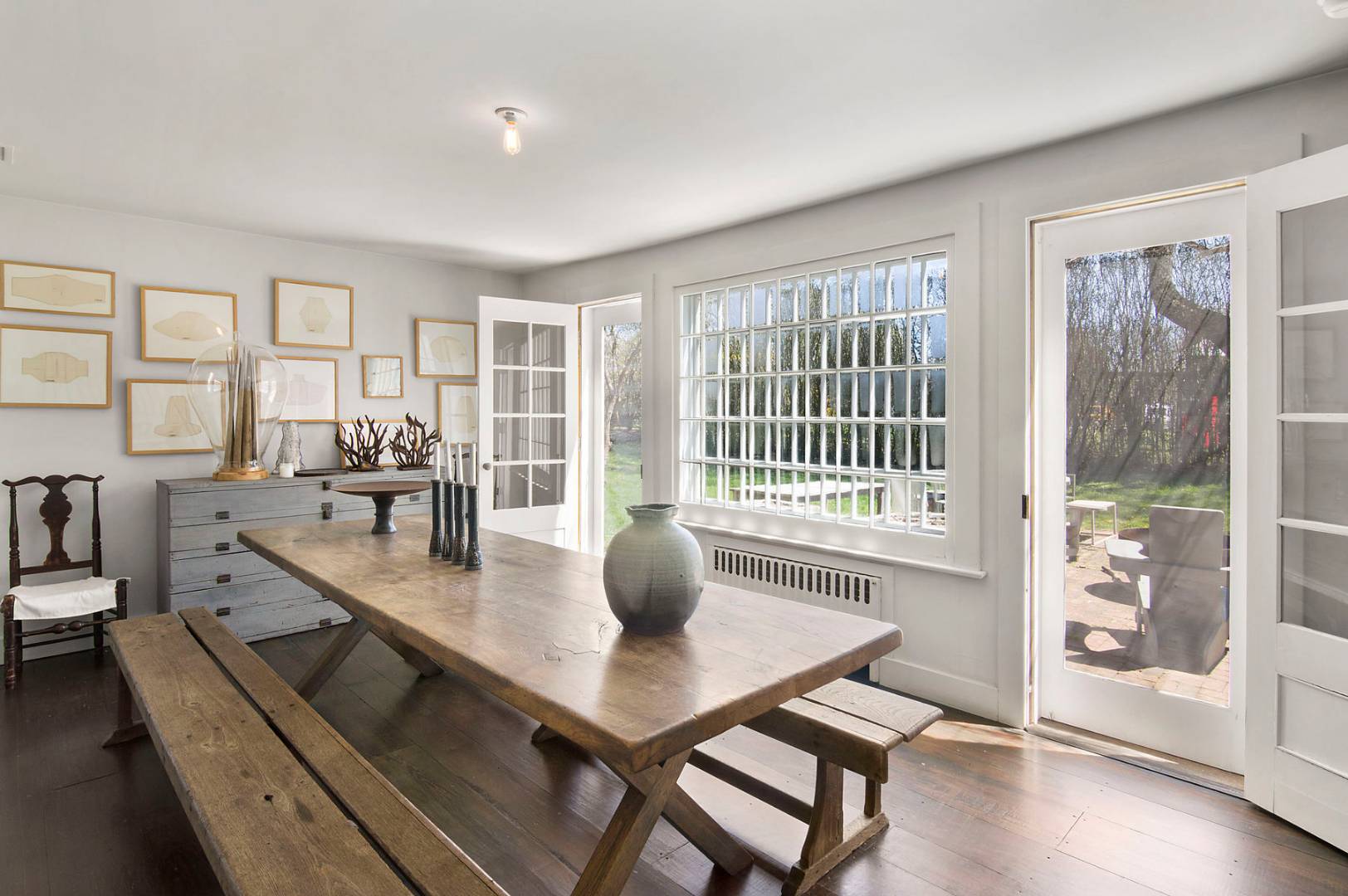 56 Sagaponack Road Bridgehampton, NY 11932 - Photo 6 of 15 a dining room with wooden floor and windows
