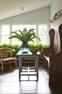 a view of living room with furniture and a potted plant