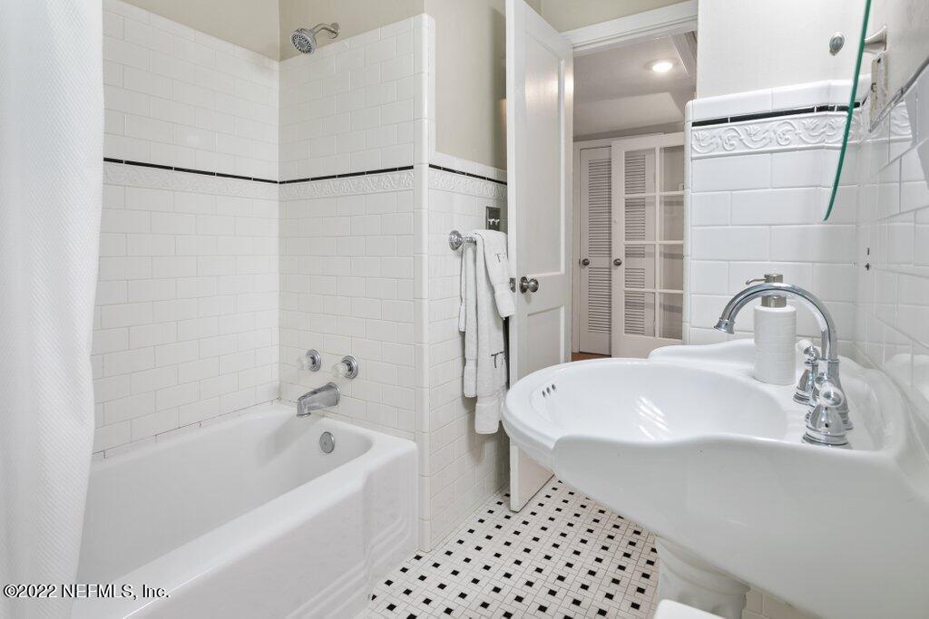 1499 Birmingham Road South Jacksonville, FL 32207 - Photo 12 of 51 a bathroom with a sink a toilet and shower