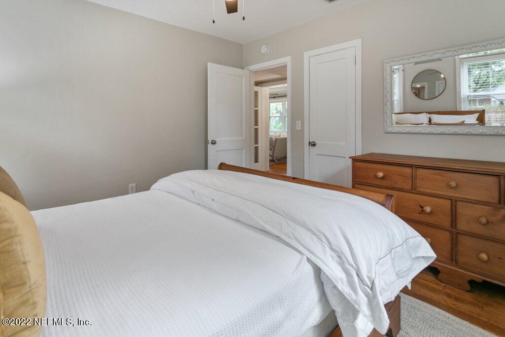 1499 Birmingham Road South Jacksonville, FL 32207 - Photo 15 of 51 a bedroom with a bed and a mirror on dresser