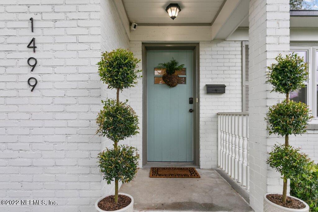1499 Birmingham Road South Jacksonville, FL 32207 - Photo 2 of 51 a potted plant sitting in front of a brick house