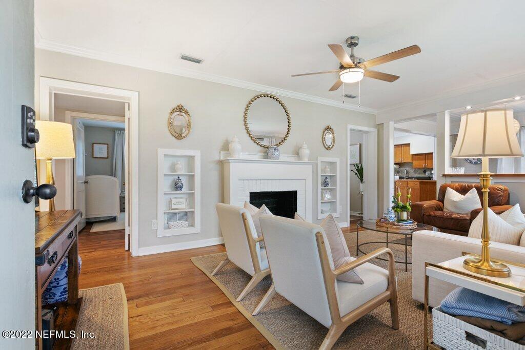 1499 Birmingham Road South Jacksonville, FL 32207 - Photo 3 of 51 a living room with furniture a fireplace and a flat screen tv