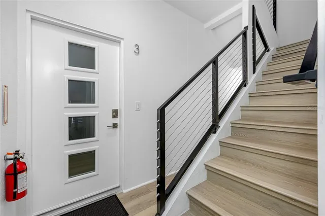 a large kitchen with a table and chairs