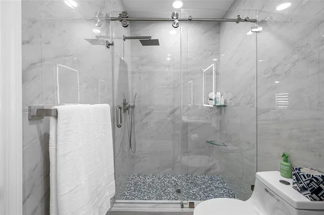 a bathroom with a sink toilet and a mirror