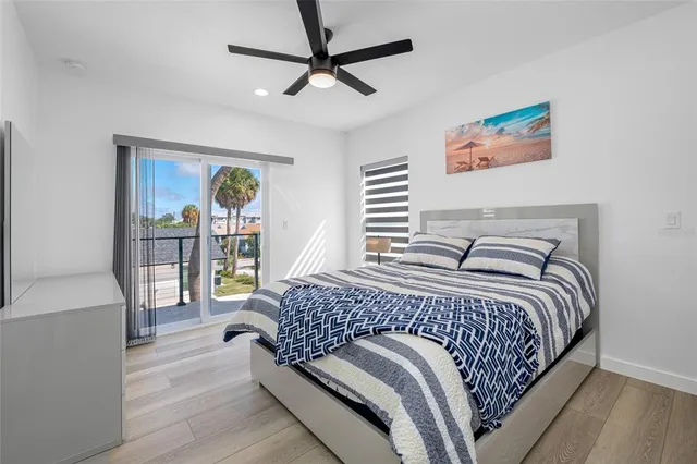 a view of a hallway and a livingroom with furniture