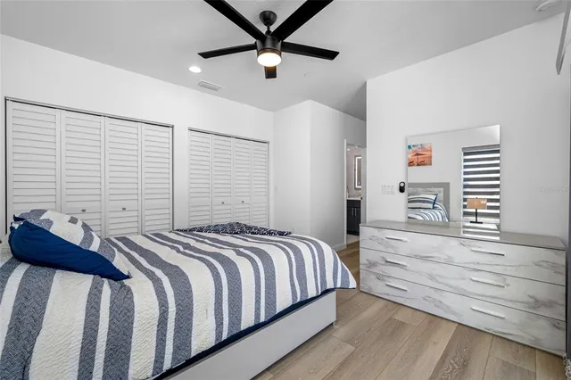 a view of a balcony with wooden floor and iron fence