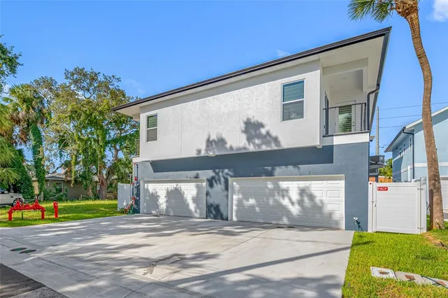 a view of empty room with wooden floor and windows