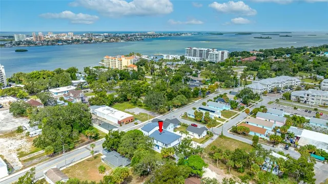 a house with a yard and table in front of it