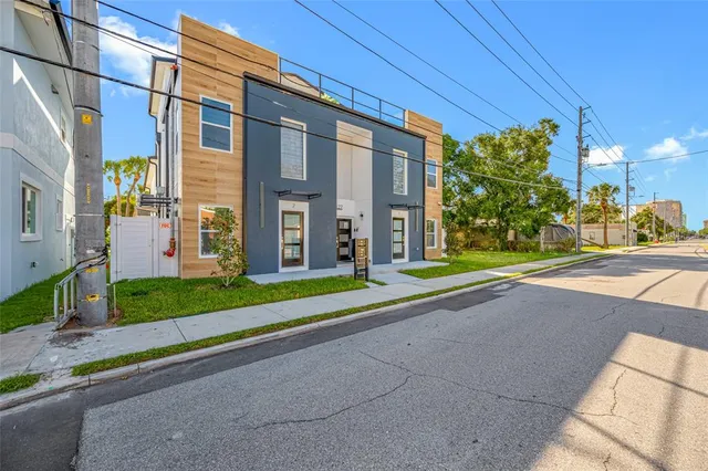 a front view of a building with garden
