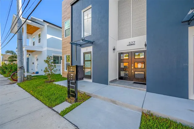 an aerial view of residential building with outdoor space and lake view
