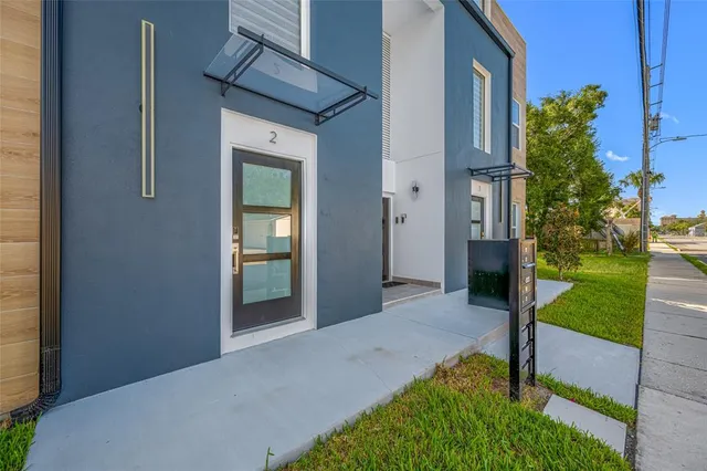 an aerial view of houses with yard