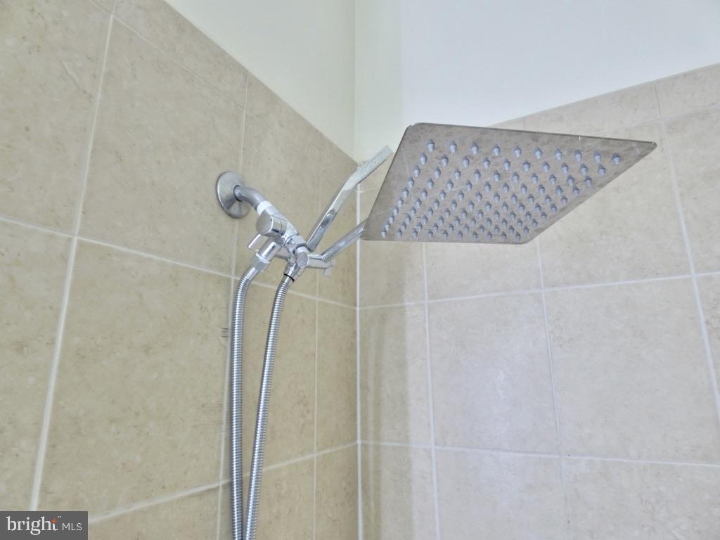 11800 Sunset Hills Road, Unit 118 Reston, VA 20190 - Photo 18 of 52 Sleek showerhead for modern living.