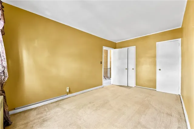 a view of a big room with windows