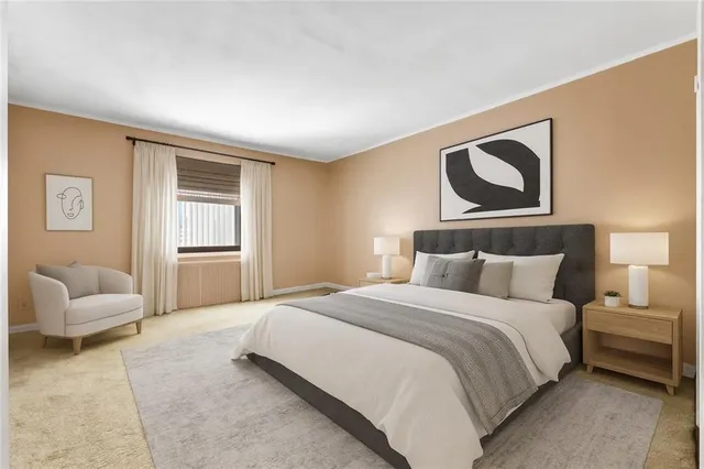 a bedroom with a bed and white couch